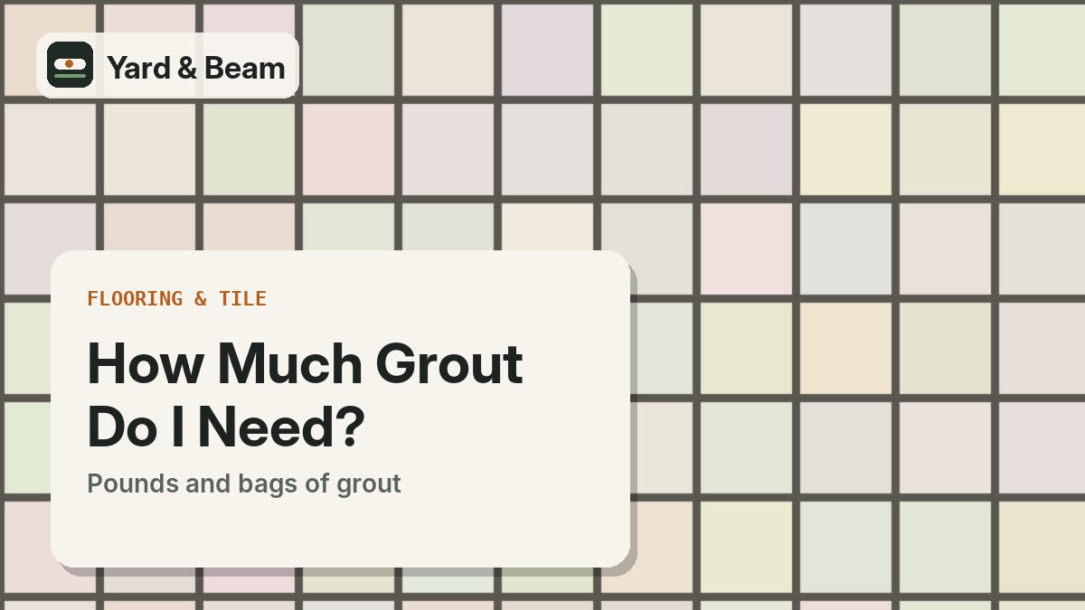 Rubber grout float spreading gray grout into the joints of square floor tiles